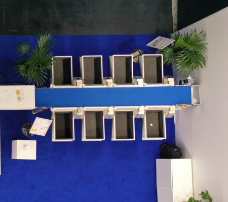 Birds eye view of 8 sorting bins along a conveyor